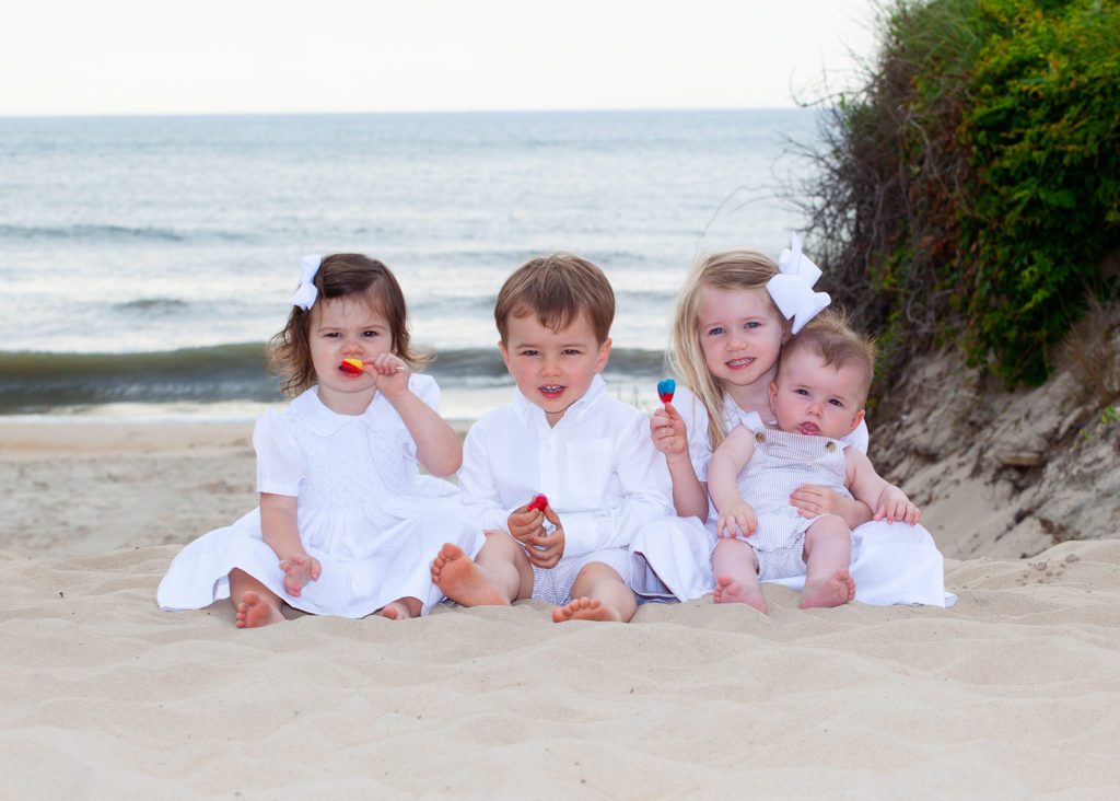 children playing during family portrait session OBX