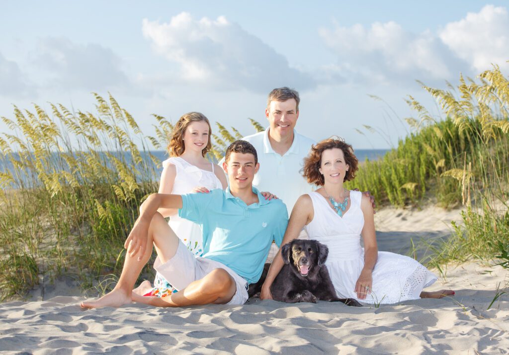 a photo of a family on the beach in corolla nc