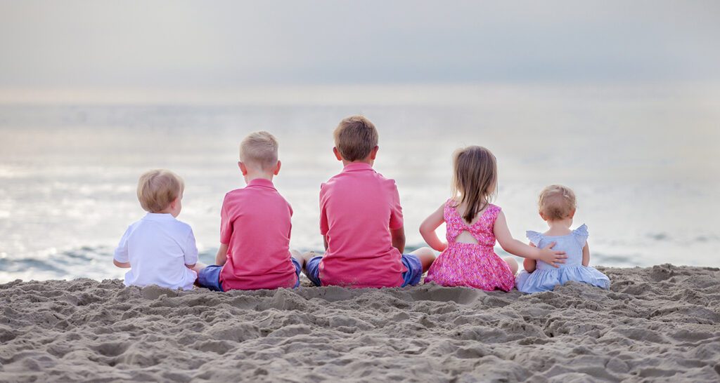 an artistic photo of kids on the beach in corolla nc
